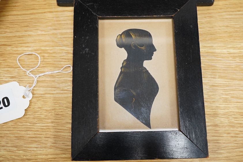 Two early 19th century cut-paper silhouette portraits of ladies, together with a stipple engraving, Portrait of a semi-nude woman, largest 10 x 8.5cm, each housed in ebonised frames
